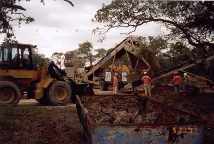 Photograph: Sifting removed soils, May 1997